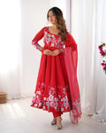 Front view of a red floral print soft organza silk Anarkali set with Badla Zari handwork