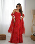 Red chiffon Bandhej print Anarkali gown with full flare, backless dori detail, pants, and dupatta.