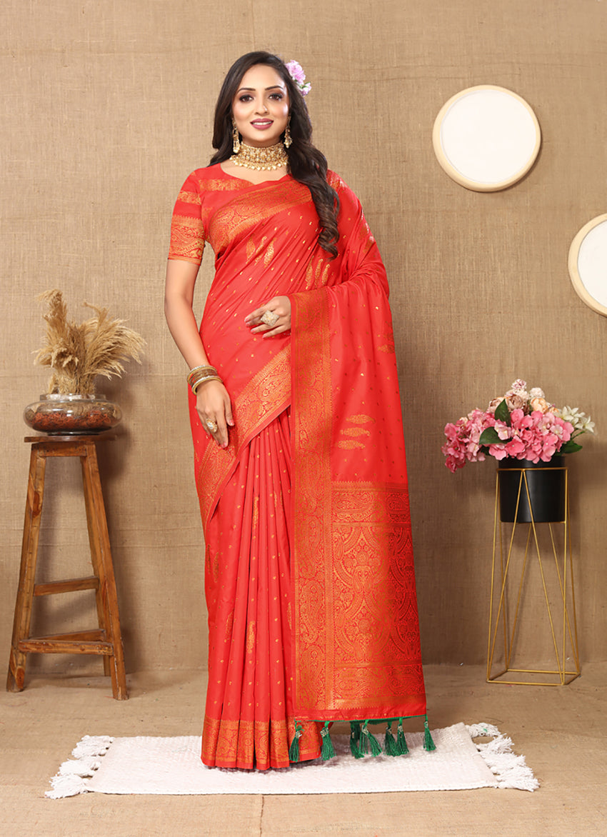Red soft silk saree featuring copper-toned Zari borders and weaving details.