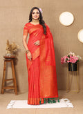 Red soft silk saree featuring copper-toned Zari borders and weaving details.