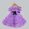 Purple net dress with black velvet bow, pearl chest detailing, and back tie