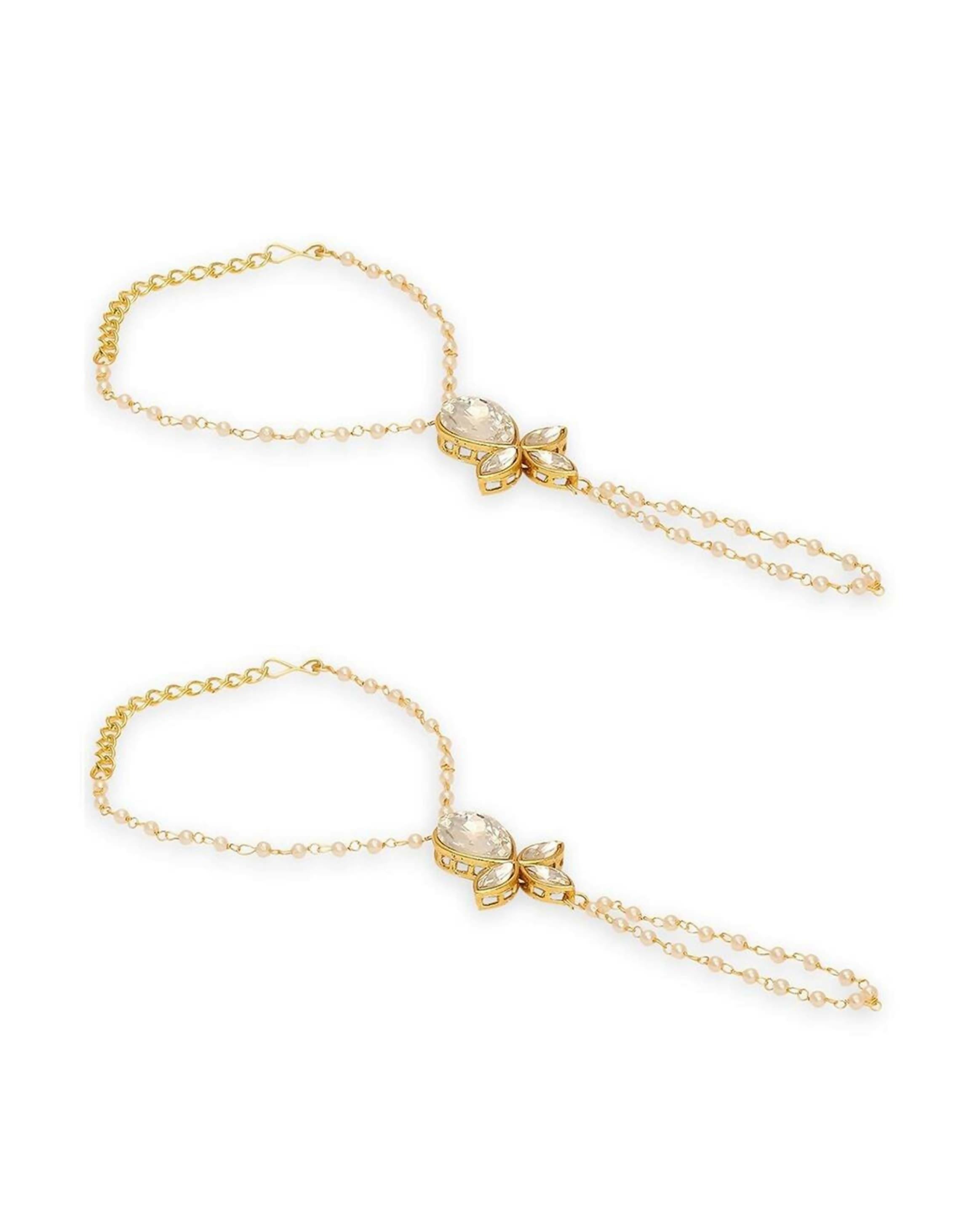 Glamorous crème bracelet with gold finish and clear marquise-cut crystal accents on a white background.