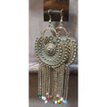 Oxidized silver Chandbali earrings with hanging chains and tassels for a bohemian party look.