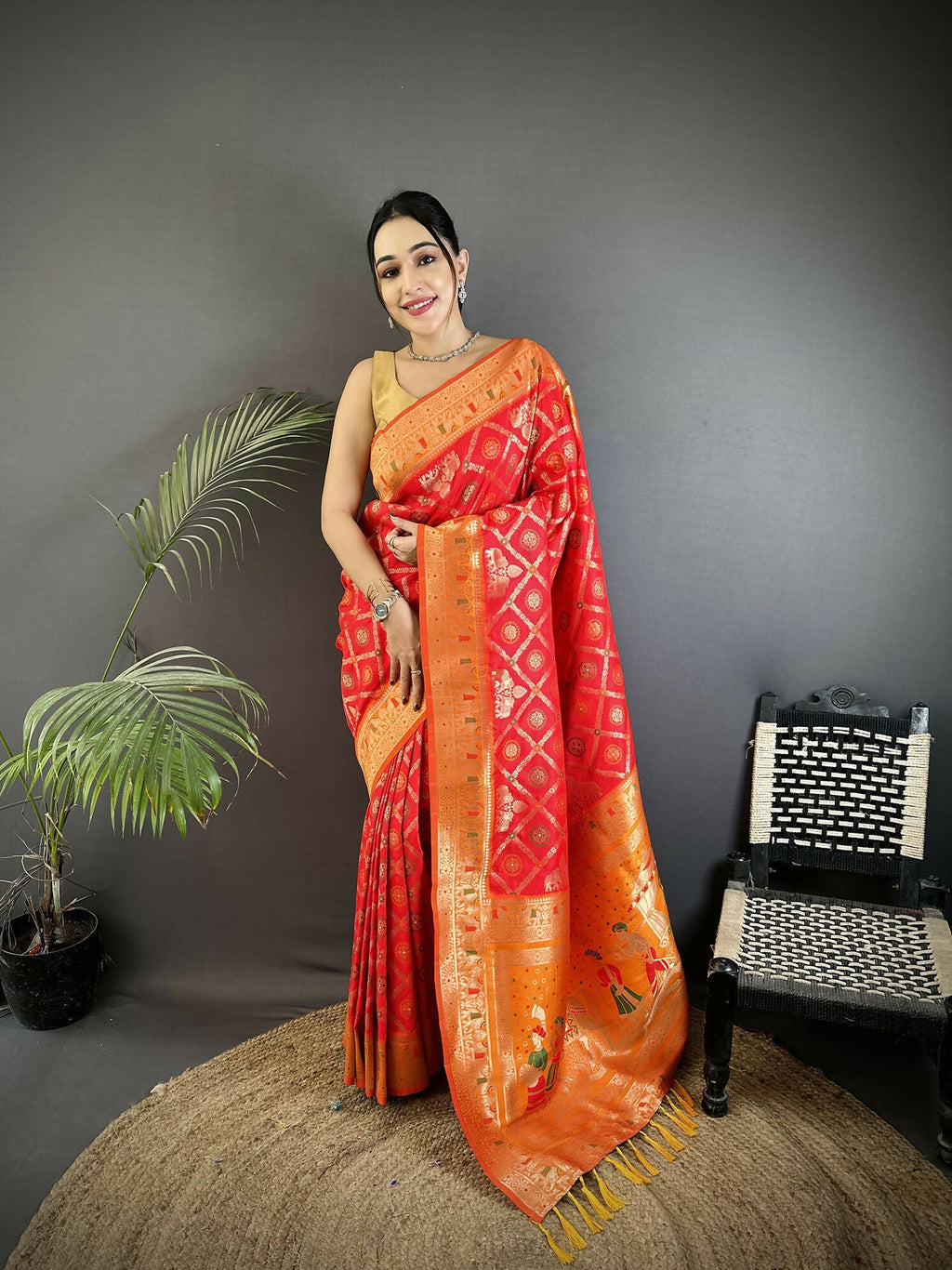 Red soft silk Patola saree with a bold geometric pattern.