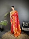 Red soft silk Patola saree with a bold geometric pattern.