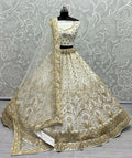 Off White bridal net lehenga choli with sequins and detailed handwork