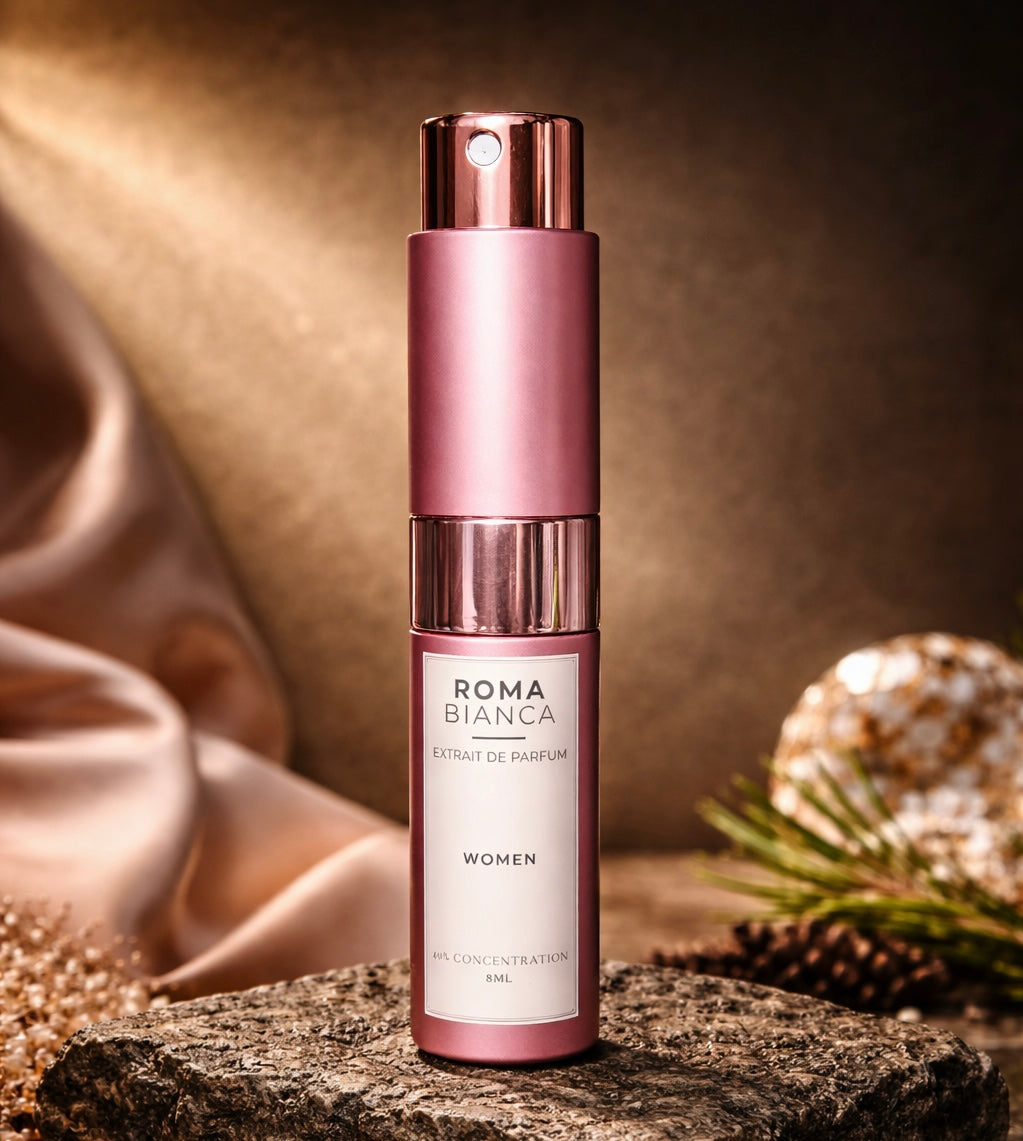 Rose-gold 8mL Roma Bianca perfume atomizer on a minimalist background