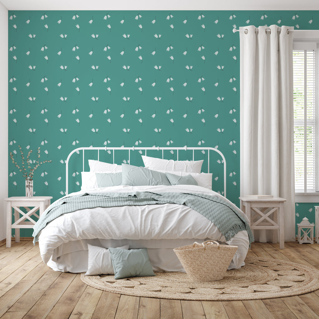 Rumi floral pattern wallpaper in teal and off-white on a minimalist bedroom wall