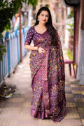 Purple slub silk saree with printed patterns and gold jacquard zari border.