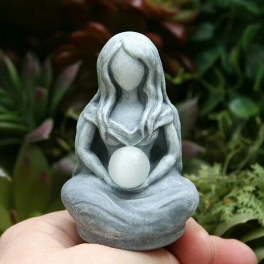 Zen-inspired Moon Goddess figurine with grey stone texture sitting on a desk