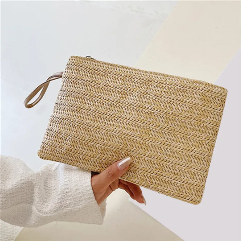 Close up and lifestyle view of a handcrafted woven straw wristlet clutch bag.
