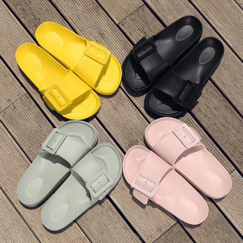 A collection of colorful EVA buckle slide slippers in yellow, black, light green, and pink.