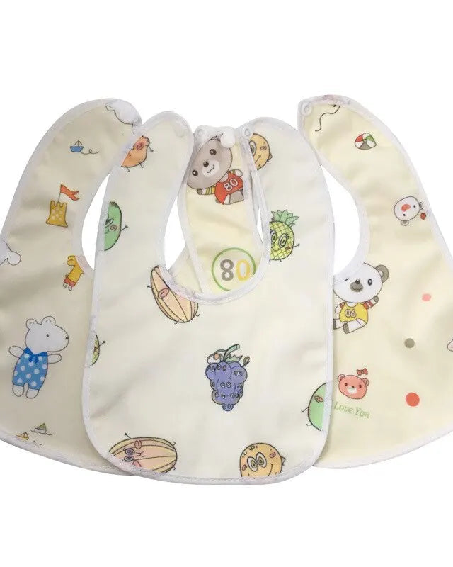 Three baby bibs with colorful patterns on a white background