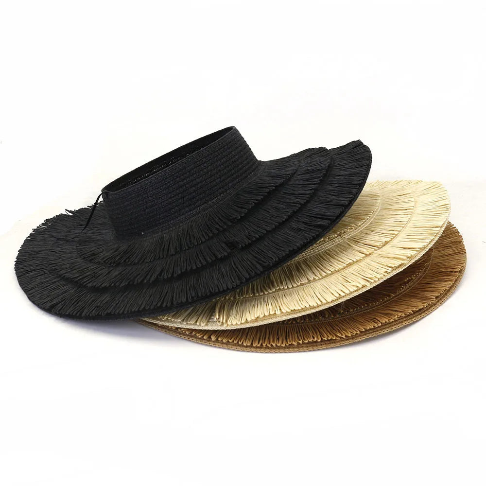 Set of three straw open-top sun visor hats in black, cream, and tan with fringed detailing.