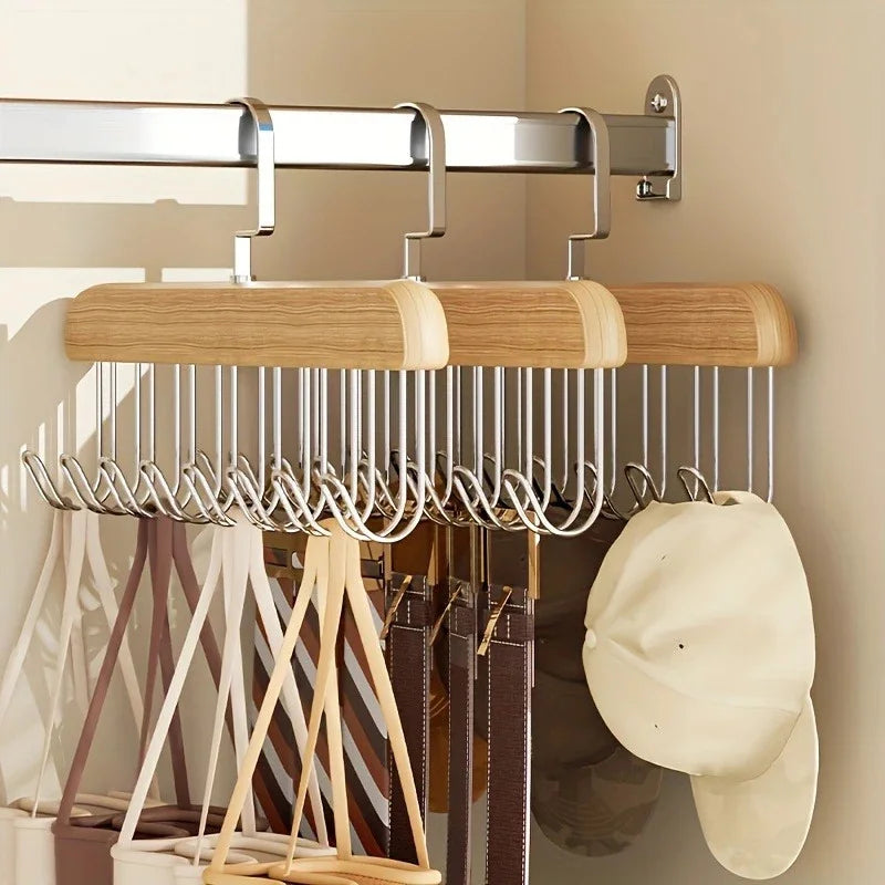 Wooden multi-hook space-saving hanger organizing bras and tank tops in a closet