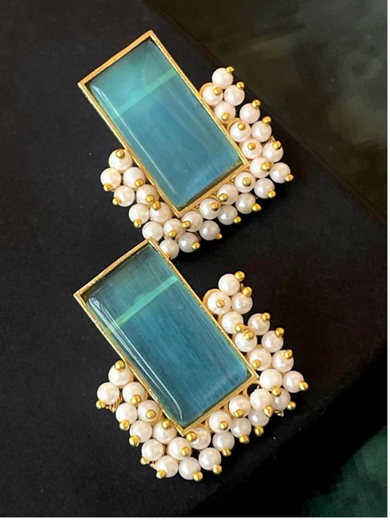 Sky blue Monalisa stone beaded stud earrings set in brass.