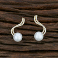 Detailed view of the Brass Golden White AD stone earrings, highlighting the brilliant stone setting.