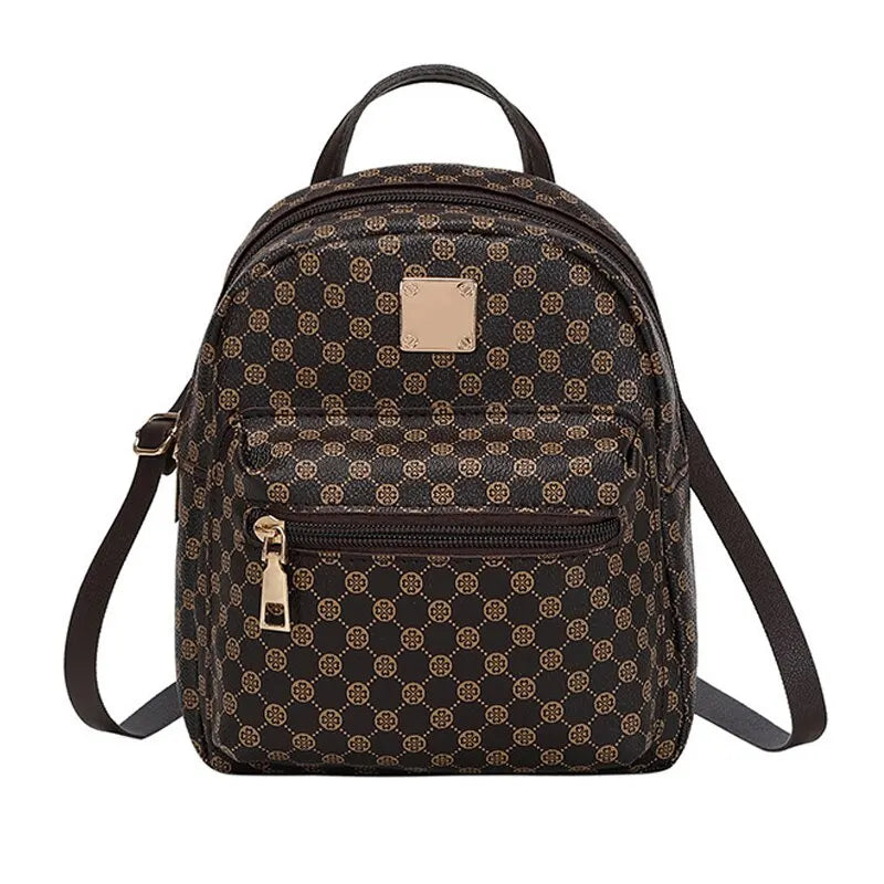 A Harajuku Style Fashion women's classic patterned backpack in dark brown, featuring a geometric logo pattern, gold-tone zippers, and adjustable straps.