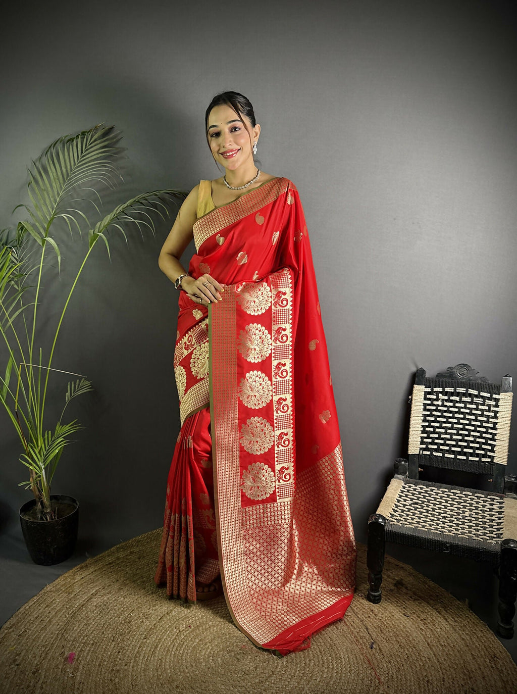 Red Banarasi Lichi silk saree featuring elegant paisley motifs