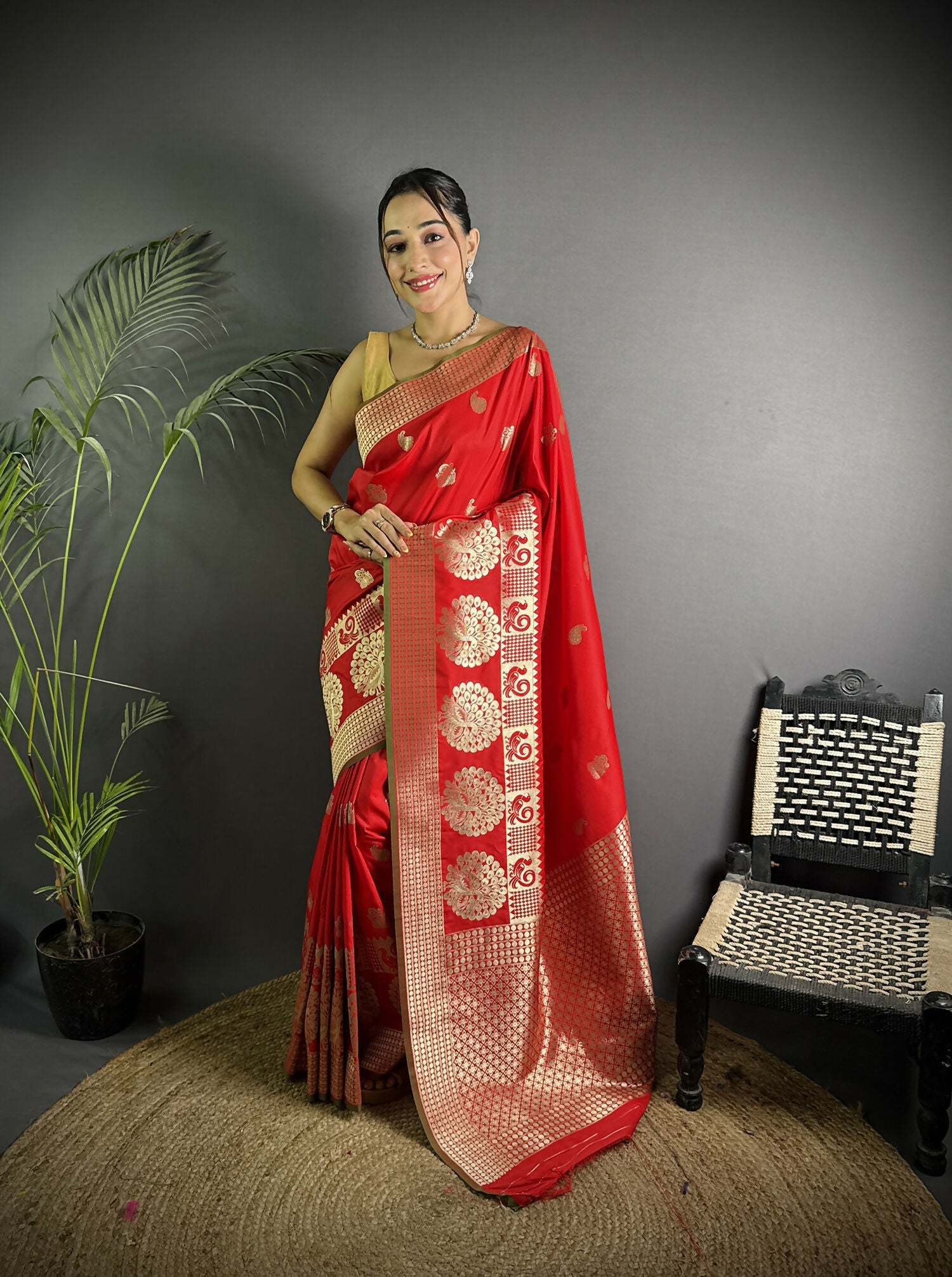 Red Banarasi Lichi silk saree featuring elegant paisley motifs