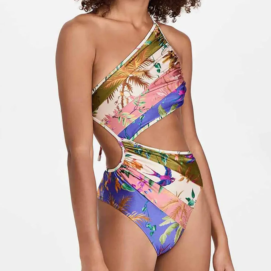 A model wearing a colorful tropical print one-shoulder cutout one-piece swimsuit viewed from the front and back.