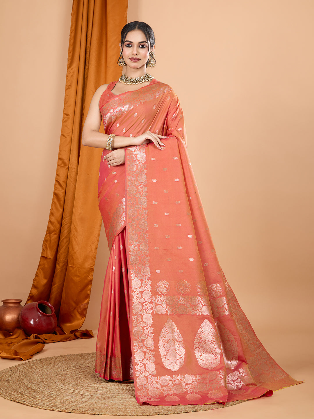 Peach Banarsi silk saree with intricate zari work and matching unstitched blouse