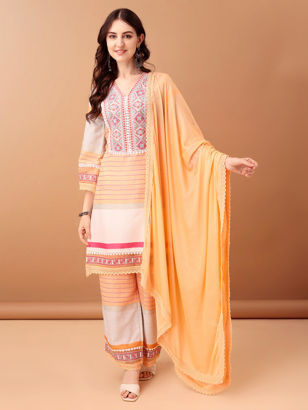 Premium orange cotton kurta set featuring embroidery and artistic prints with matching dupatta.