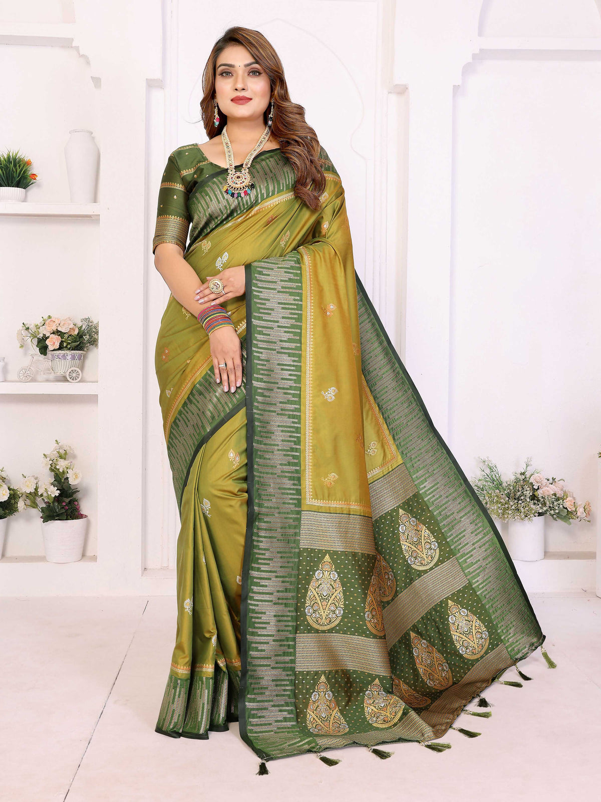 Pista Green South Soft Silk saree with detailed zari weaving and matching blouse piece