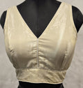 Elegant cream chinnon readymade blouse with gold glaze, V-neck, and back-open detail.