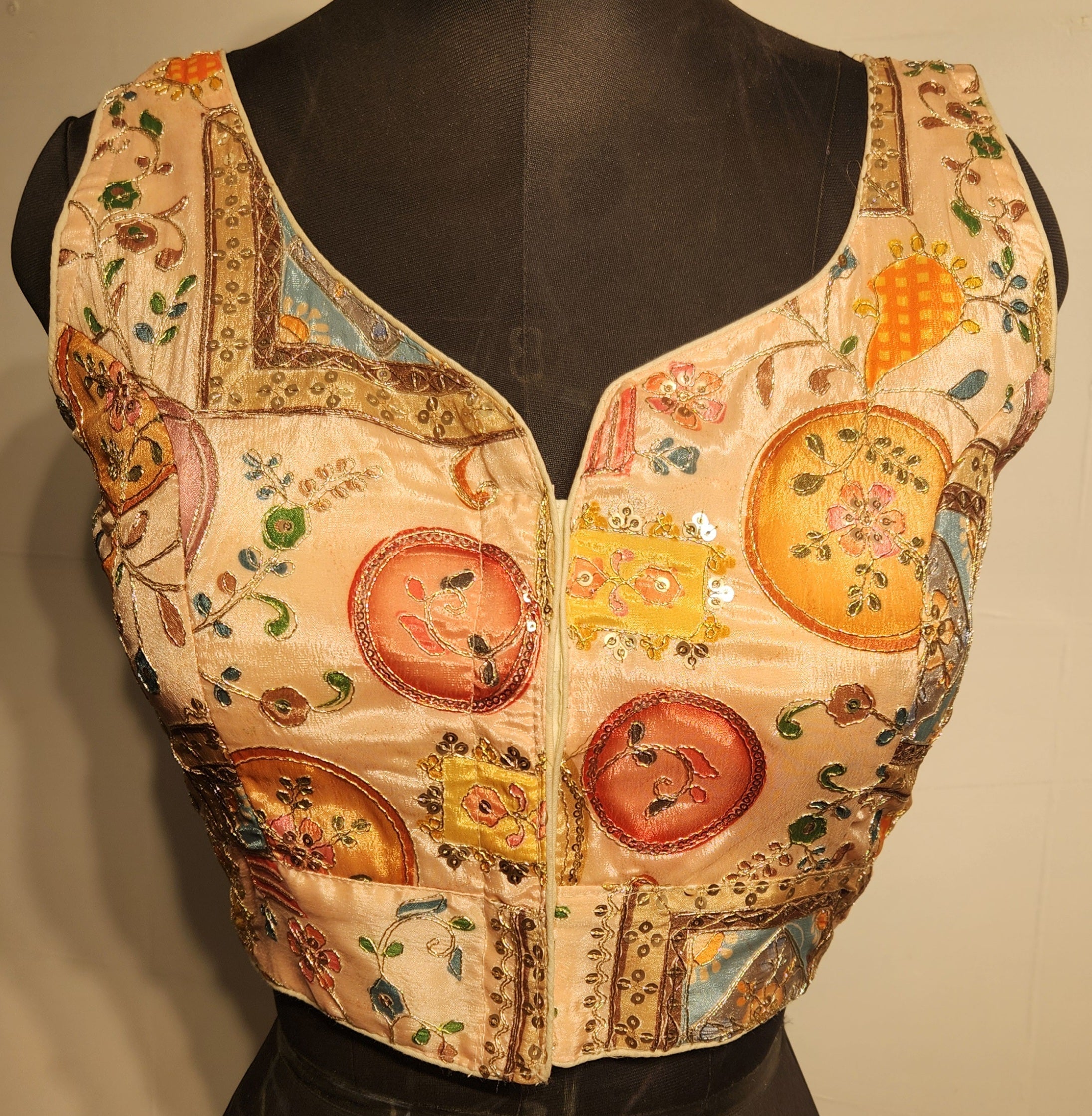 Peach readymade blouse with sequins and zari embroidery and sweetheart neckline