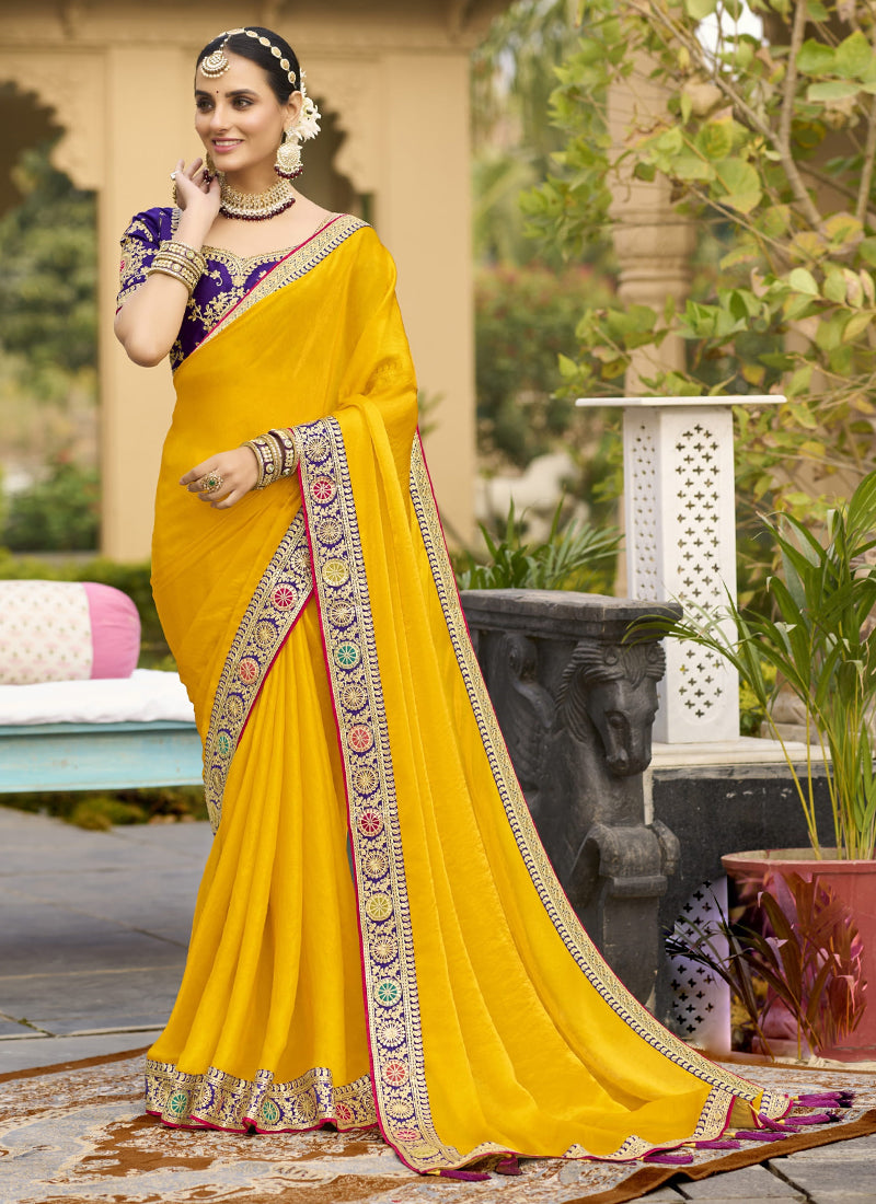 Vibrant Yellow Georgette saree with intricate embroidery work, perfect for weddings