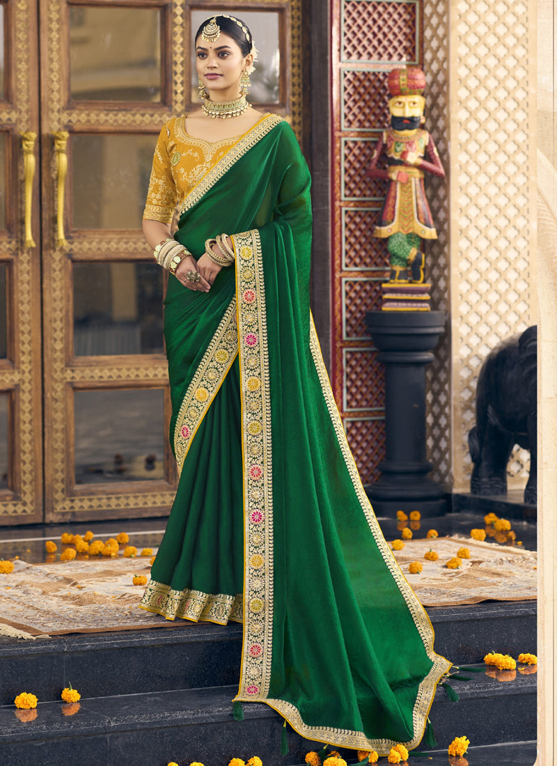 Close up of green wedding wear saree with intricate embroidery