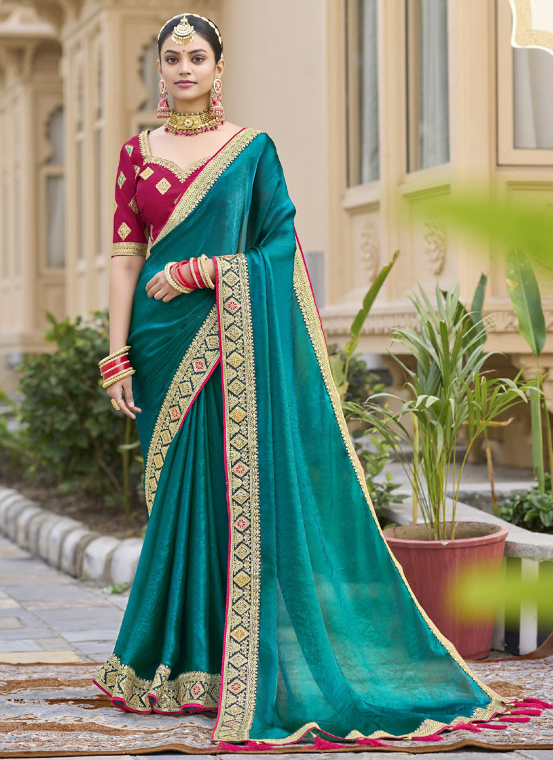 Aqua green georgette saree with detailed embroidery for wedding festivities