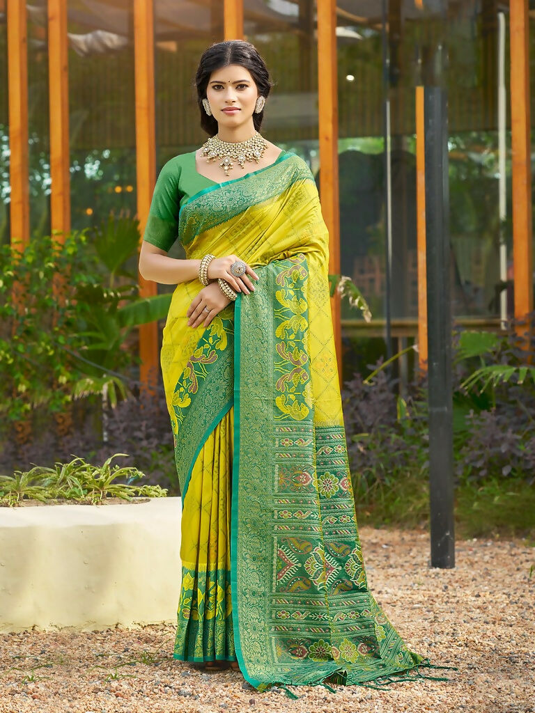 Mustard soft silk saree with matching blouse piece featuring a smooth texture.