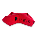 A durable, red and yellow double-loop firehose tug toy for dogs on an outdoor surface