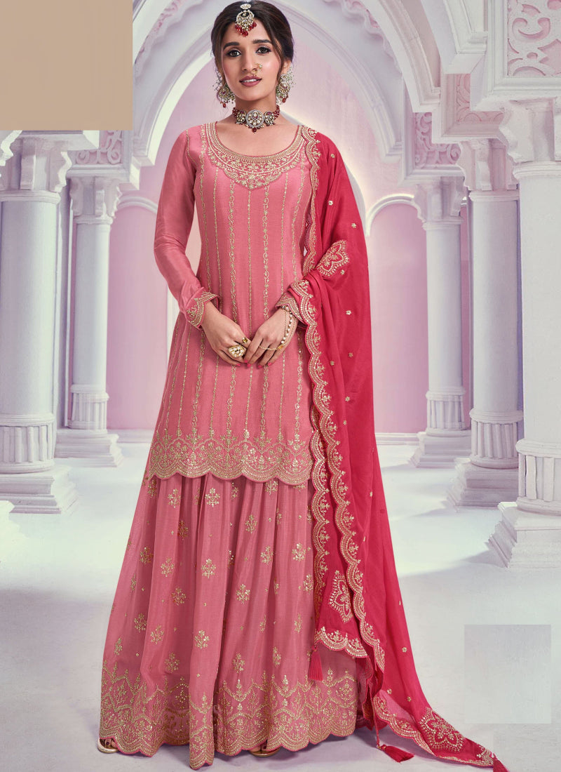 Front view of a Peach Zari Chinon Silk Palazzo Suit with round neck and detailed embroidery.