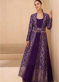 Woman wearing a floor-length purple brocade georgette gown suit with geometric gold accents and scoop neckline