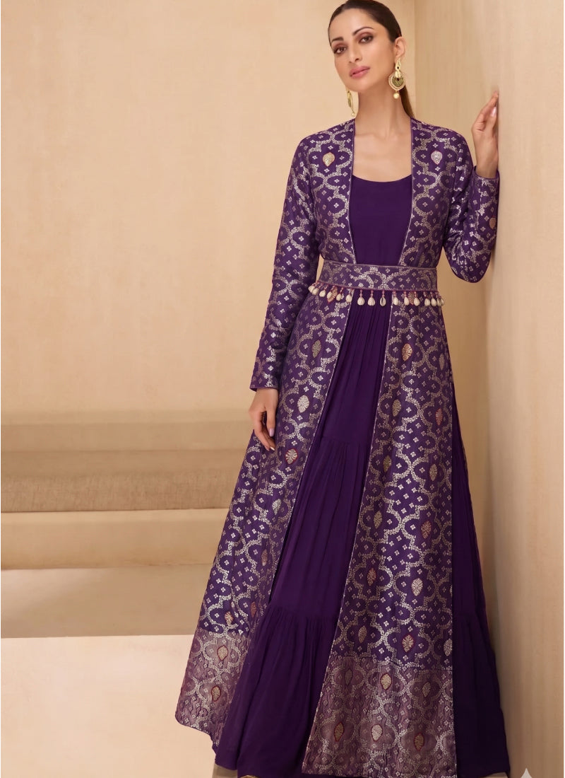Woman wearing a floor-length purple brocade georgette gown suit with geometric gold accents and scoop neckline
