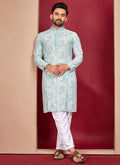 Close-up of off-white rayon fabric with detailed Lucknowi embroidery on the kurta