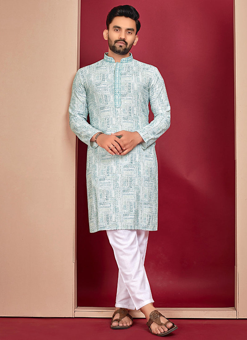 Close-up of off-white rayon fabric with detailed Lucknowi embroidery on the kurta