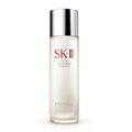 Clear glass bottle of SK-II Pitera Facial Treatment Essence on a clean background