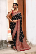 Sophisticated black crepe chiffon Banarasi handloom saree with a fluid drape.