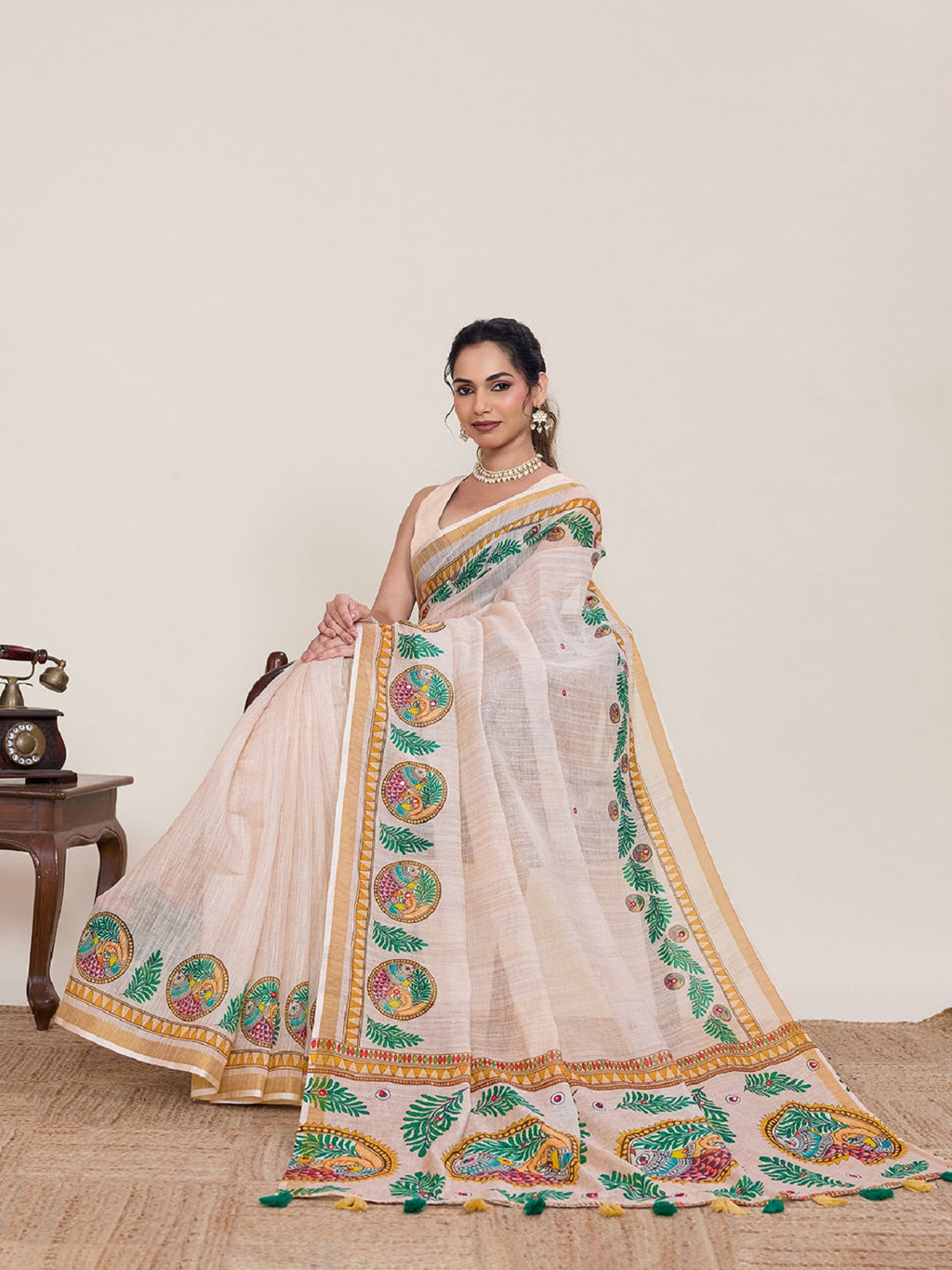 Ivory linen saree with detailed mirror work and unstitched blouse piece