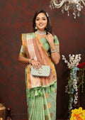 Seagreen cotton saree with metallic gold zari weaving, geometric border, and tassel pallu