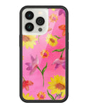 A phone case featuring a bright pink background with watercolor-style yellow sunflowers and purple tulips, enclosed in a black rubber protective bumper.
