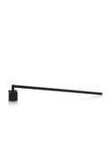Silver metallic cube-shaped candle snuffer resting on a surface