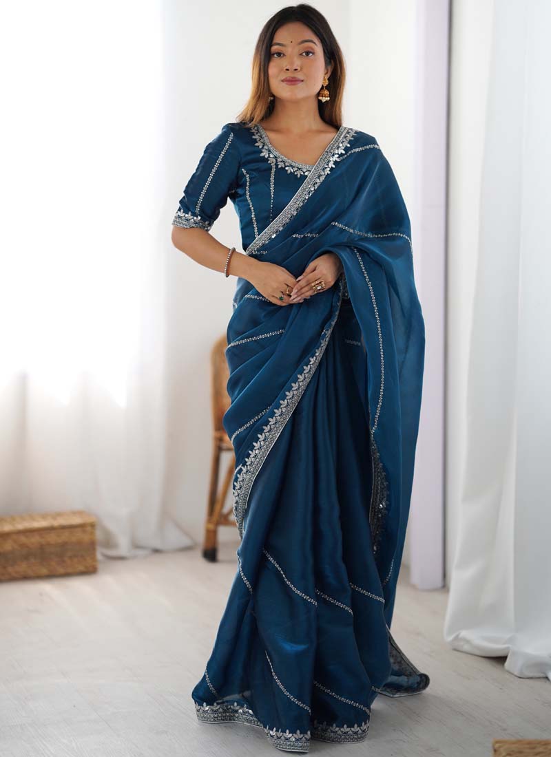Rama color organza silk saree with elegant thread and sequin embroidery