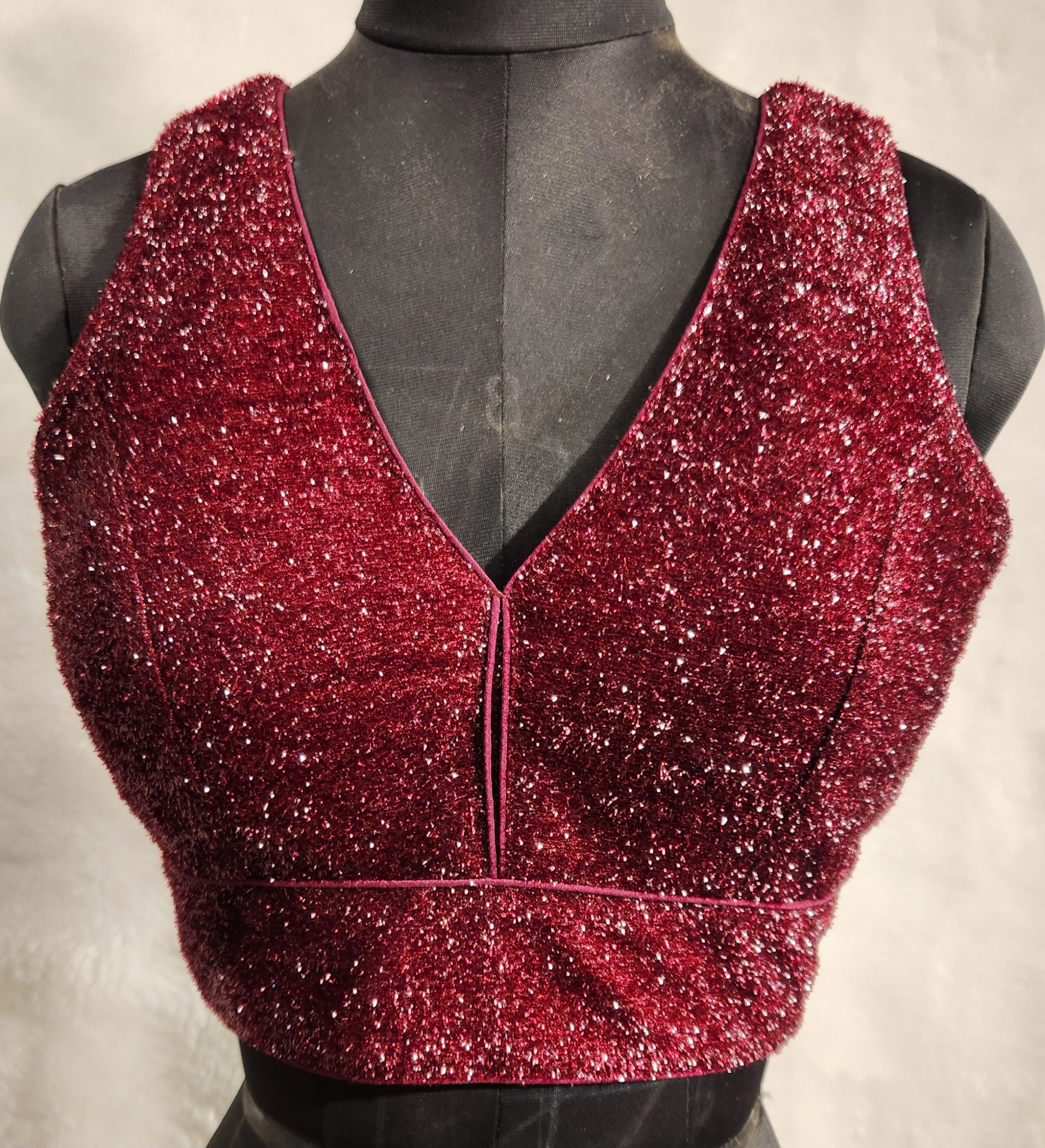 Maroon shimmery terry fabric blouse with V-neckline and back-open style