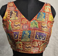Rust colored Jacquard weave readymade blouse with V-neck and multi-color motifs