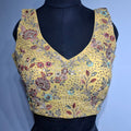Eggyolk yellow georgette blouse with multi-color embroidery and sequin work